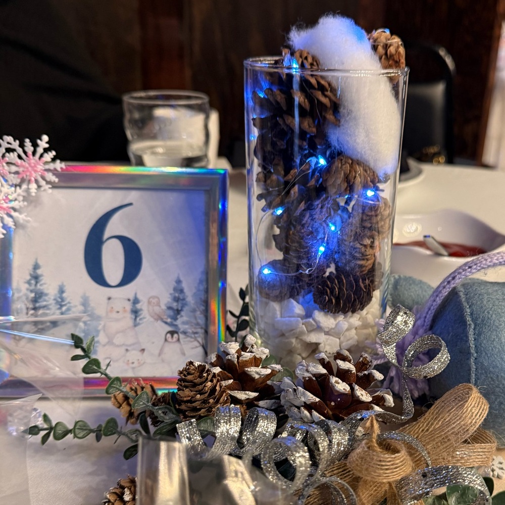 Set of six winter themed baby shower framed table numbers with snowflakes.